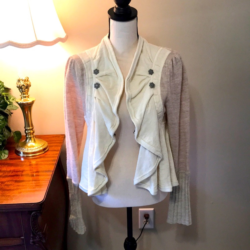 Free People waist length sweater. Super cute ribbon on back. (Runs small)